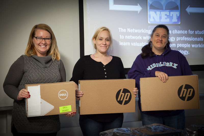 MxCC students Amy Heidel, Brandy Dykas, and Sherry Moran receive laptops from the Computer Club Laptop Giveaway Contest in December. 