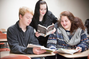 students reading together in classroom