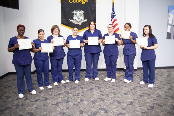 CNA grads receive their certificates