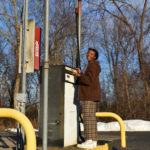 girl standing at air pump station