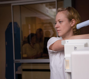 woman at radtech machine